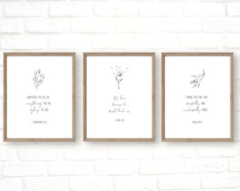 May include: Three printable wall art prints with black and white floral illustrations and inspirational quotes. The first print says "Whatever you do do everything for the glory of God (1 Corinthians 10:31)". The second print says "We love because he first loved us (1 John 4:19)". The third print says "I praise you for I am fearfully and wonderfully made (Psalm 139:14)".