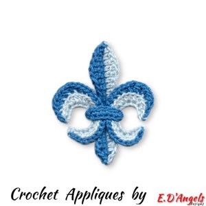 May include: A blue and white crochet fleur-de-lis applique. The handmade applique features a detailed design with alternating sections of light blue and white yarn. The text "Crochet Appliques by E.D'Angels designs" is at the bottom.