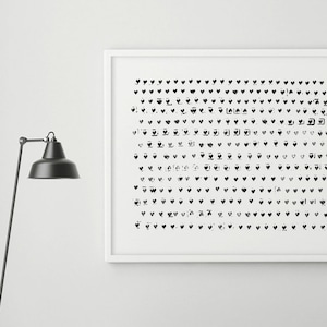 May include: A framed black and white abstract art print featuring a pattern of small heart shapes. The artwork hangs above a gray upholstered bench with a dark wooden frame. A black floor lamp stands to the left, and the floor is white.