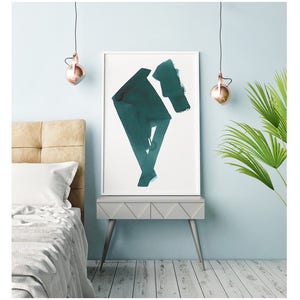 May include: Abstract teal watercolor art print in a white frame. The artwork features geometric shapes and brushstrokes. The print is displayed on a gray nightstand with a bed and a palm plant in the background. Copper pendant lights hang from the ceiling.