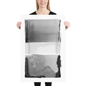 May include: A black and white abstract art print featuring three horizontal rectangular shapes. The top and bottom shapes are dark gray, while the middle shape is white. The artwork has a watercolor effect.