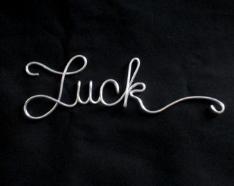 wire word luck, wire words, luck, wire script words, wire cursive words, wire writing, hanging words, wire works, word wall art