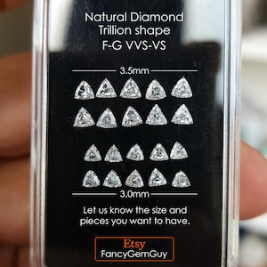 calibrated 3x3mm trillion cut natural diamonds arranged on a black card in a clear case, multiple stones shown for matching and selection, sharp triangle symmetry, F G near colorless VVS VS, jewelry making side stones