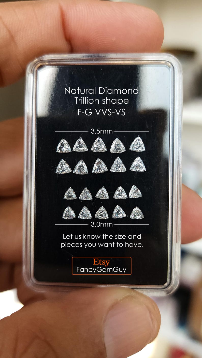 calibrated 3x3mm trillion cut natural diamonds arranged on a black card in a clear case, multiple stones shown for matching and selection, sharp triangle symmetry, F G near colorless VVS VS, jewelry making side stones