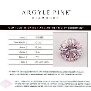 May include: A gem identification document for an Argyle Pink diamond. The document includes the diamond's ID number, carat weight (0.13ct), shape (round), clarity (SIAV), color (7PP), and the date of assessment (June 22, 2020).