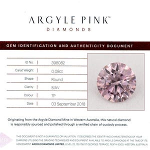 May include: A document from Argyle Pink Diamonds with a round, pink diamond. The document includes details such as the diamond's carat weight of 0.08ct, shape, clarity, and color grade of 7P. The text reads "GEM IDENTIFICATION AND AUTHENTICITY DOCUMENT."