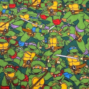 May include: A white ceramic mug with a black handle and the text "But First, Coffee" in a black, bold font. The mug is sitting on a white surface. The mug is approximately 4 inches tall.