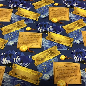 May include: A fabric pattern featuring gold-colored train tickets and handwritten notes on a dark blue background. The tickets read "The Polar Express" and the notes include the phrase "Better fix that hole in your pocket." Small golden bells and blue gift boxes are also scattered across the fabric.