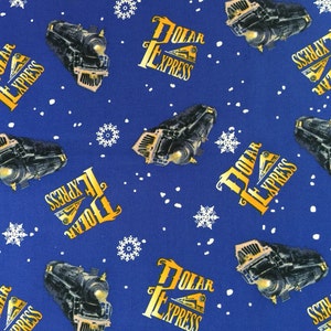 May include: Blue fabric with a repeating pattern of black steam trains, the words "POLAR EXPRESS" in gold, white snowflakes, and white dots. The train has a yellow headlight.
