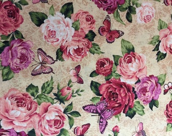 May include: A fabric with a floral pattern featuring large pink and purple roses, green leaves, and butterflies. The butterflies have pink and purple wings. The background is a light beige colour with a textured appearance.
