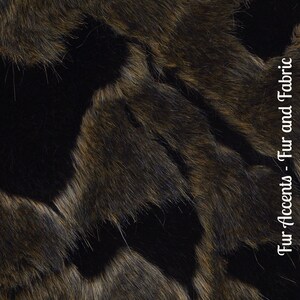 May include: Close-up of a brown and black faux fur fabric. The fur has a soft, plush texture and a subtle sheen. Fur Accents - Fur and Fabric.