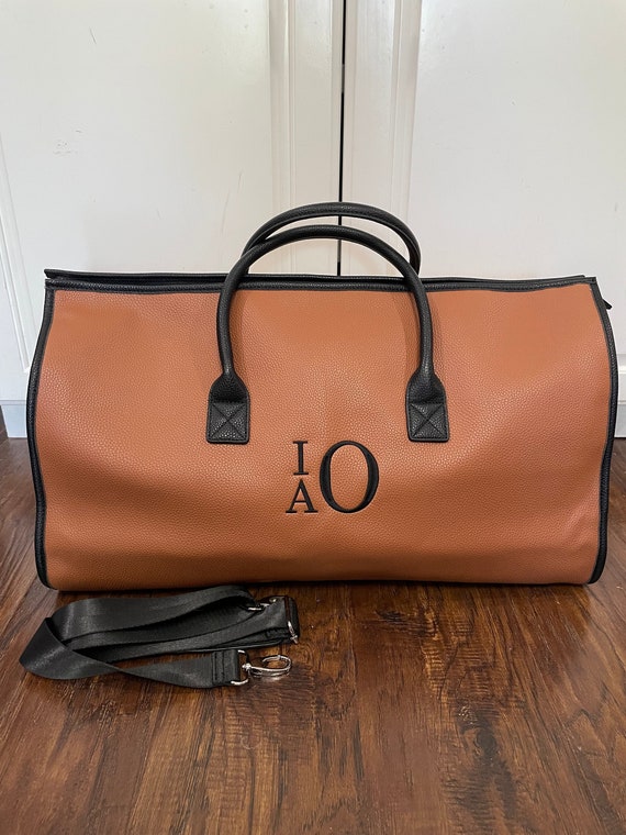 Calvin klein hotsell monogram duffle bag