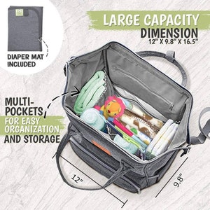 May include: A gray diaper bag with multiple pockets and a changing mat. The bag is open and filled with baby items, including a toy lion, bottles, and blankets. The bag measures 12 inches by 9.8 inches by 16.5 inches.