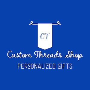 May include: White banner with the letters "CT" in blue on a blue background. The text "Custom Threads Shop PERSONALIZED GIFTS" is below the banner.