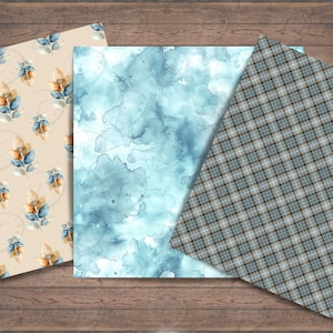 Op de afbeelding: Drie digitale papierontwerpen met een blauw-bruin ruitpatroon, een aquarelblauwe achtergrond en een beige achtergrond met een herhalend patroon van blauwe en bruine bladeren.