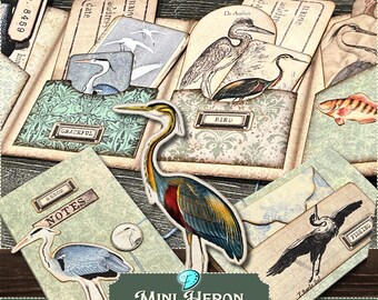 May include: A printable folio kit with a mini heron theme. The kit includes a variety of cards and papers with images of herons, birds, and fish. The cards are decorated with a vintage style and have text such as "Graceful", "Bird", and "Notes".