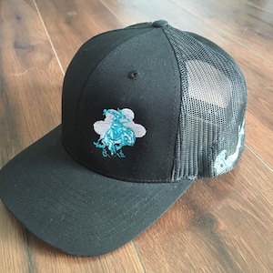 Black on Black Trucker Cap with Teal & Gray Rawhide and Rust Logo