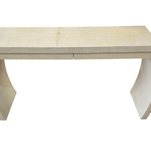 May include: A light-colored, modern desk with a curved base and a rectangular top. The desk has two drawers and is made of a light-colored material, possibly wood. The desk is approximately 60 inches long and 30 inches wide.