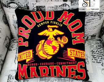 May include: A black pillow with red and yellow text and a yellow and red emblem. The text reads "Proud Mom", "Semper Fidelis", "United States", "Honor Courage Commitment", and "Marines".