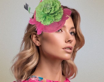 Beautiful hot pink fascinator adorned with green flower and feather details