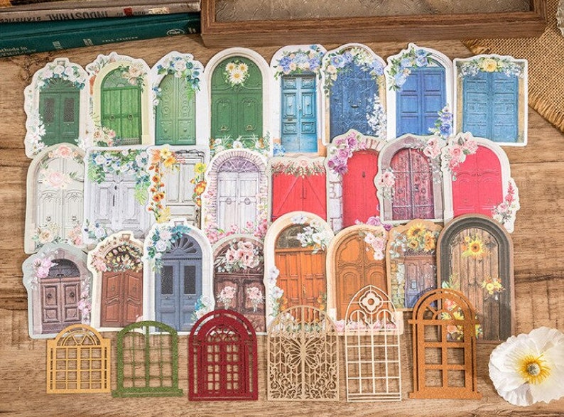 May include: A set of 20 decorative door stickers featuring various styles of doors with floral accents. The stickers are printed on white paper and have a matte finish.