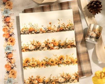 Könnte beinhalten: Vier Rollen Washi-Tape mit Blumen- und Sonnenblumenmotiven. Das Band befindet sich auf einem weißen Hintergrund mit einem karierten Stoff und einer Kiefernzapfen.