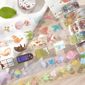 Achtergrondmuziek. Japans. Washi-tape. PET. Verijdeld. Zomer 2024. Katten. Ramen. Oceaan. Vogels.