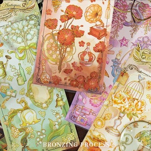 2 bladen, ongesneden, verguld, stickers. Gouden folie. Antiek. Vintage voorwerpen. Bloemen. Kofferbak. Lamp. Spiegel