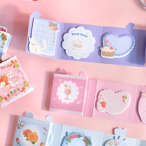 Folding sticky notes booklet. Kawaii. Strawberry cat. Cartoon.