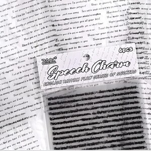 May include: A white package with black text that reads "ZABC Speech Charm English Rhythm Flow Series of Stickers" and a black and white sticker sheet with a repeating pattern of black lines.