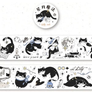 May include: Black and white washi tape featuring a repeating pattern of cats, stars, moons, and other celestial elements. The text "kitty cat" and "kitty y cute" are included in the design.