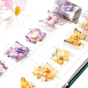 Rouleau d'autocollants papillons prédécoupés. Matériau PET, mat. Papillon en cristal. Fleurs.
