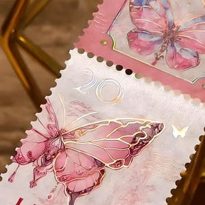 1 rouleau, feuille d'or, tampons, autocollants. Papillons en cristal. Embellissement.