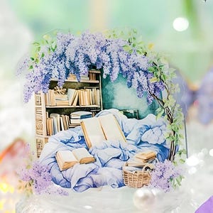 May include: A watercolor illustration of a cozy reading nook with a bookshelf filled with books, a bed with blue blankets, and a basket of books. The scene is framed by a garland of purple wisteria flowers.