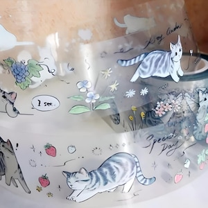 6 diseños. 1 lazo. Cinta PET. Estampado láser. Brillante. Ilustración de gato. Astronauta. Sirena. Flores. Conejo blanco. Alicia en el país de las maravillas