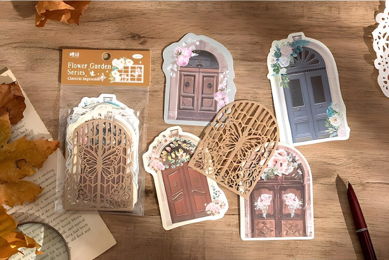 May include: A set of decorative stickers featuring various ornate doors with floral accents. The stickers are part of a "Flower Garden Series" and are designed for crafting and scrapbooking.