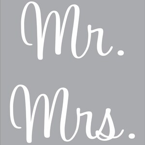 May include: White cursive text on a gray background. The text reads "Mr." and "Mrs."