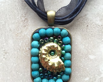 Golden Nautilus pendant necklace