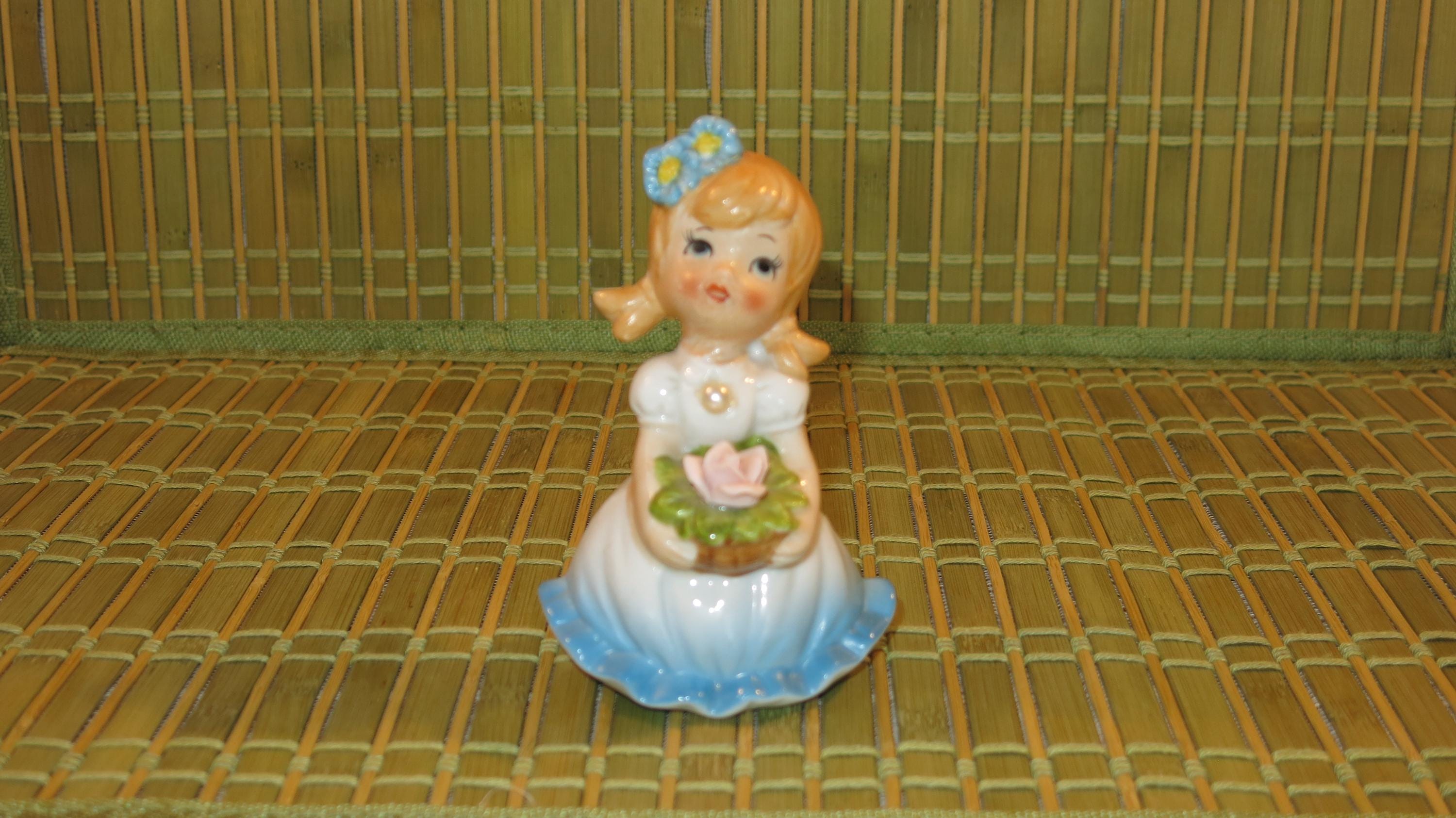 Little Flower Girl Figure With Pearl on the Front of Blue Dress