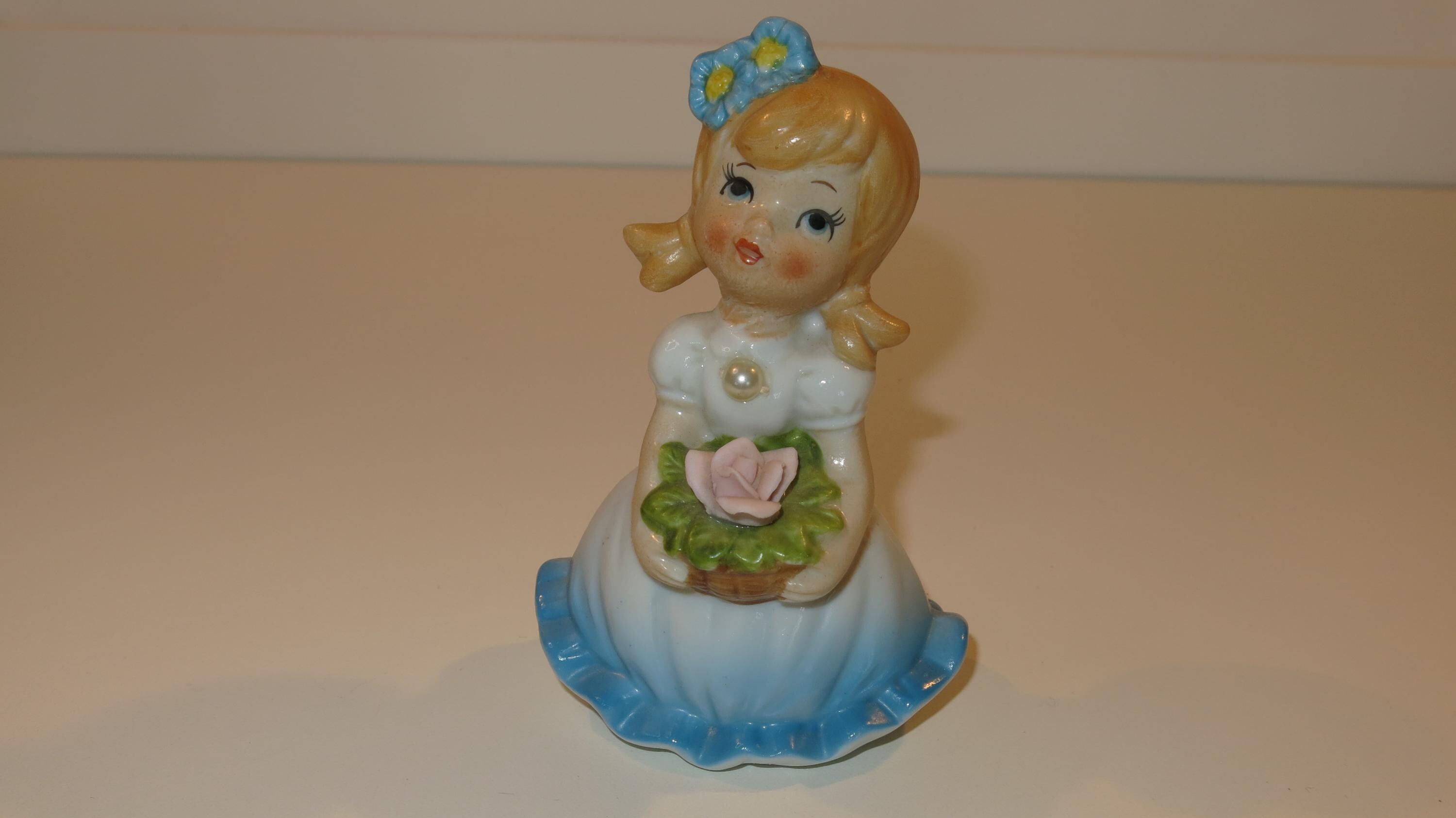 Little Flower Girl Figure With Pearl on the Front of Blue Dress