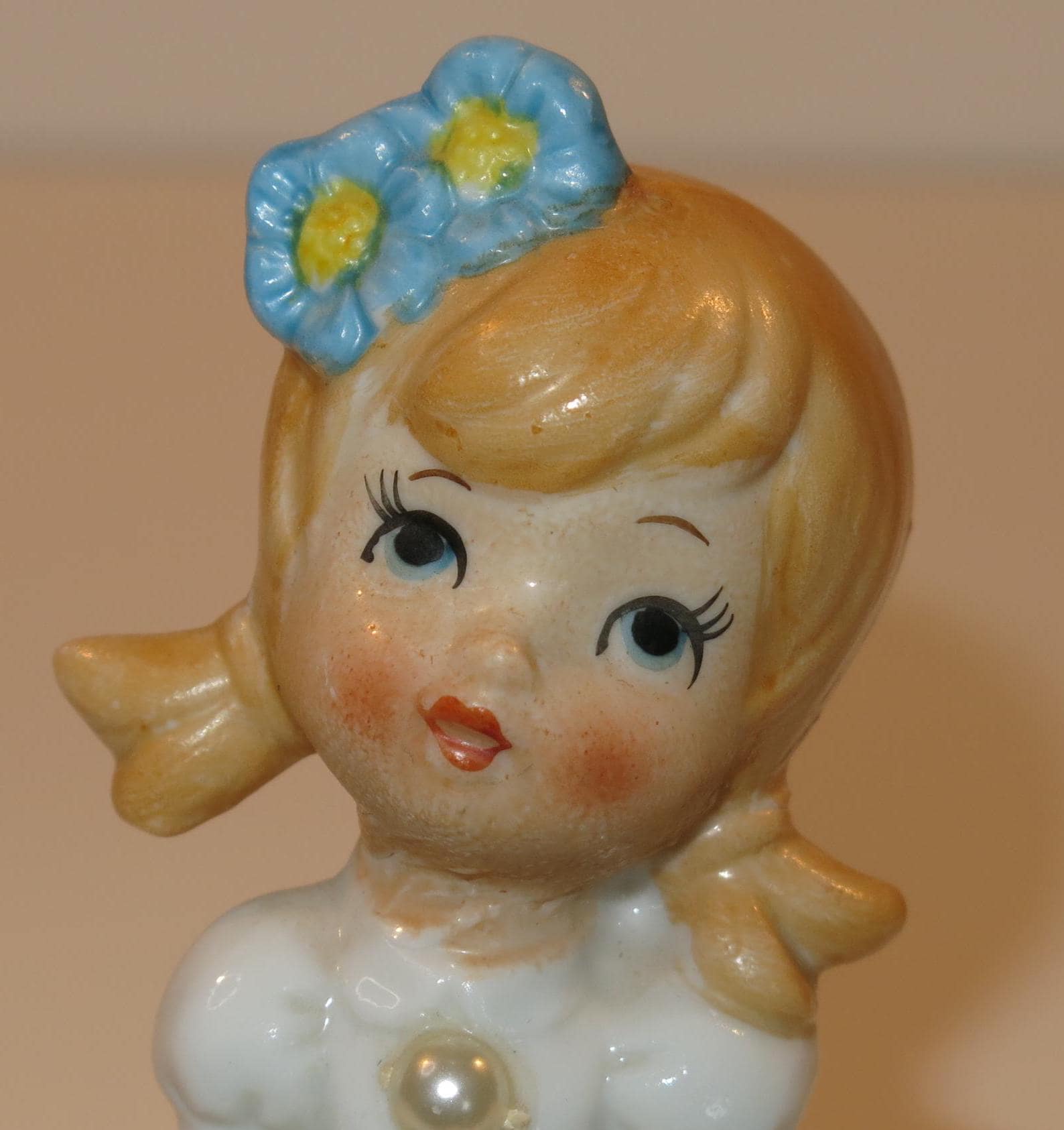 Little Flower Girl Figure With Pearl on the Front of Blue Dress