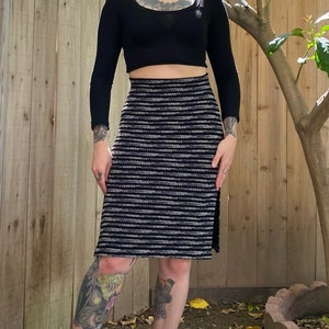 Y2K 2000’s black stretchy pencil skirt with grey and white polka dot stripes. Elastic waist. Open slit up each side. Size small