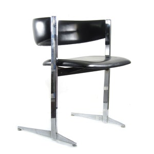 Stylish and sophisticated black and chrome sixties vintage dining chairs