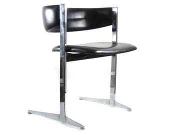Stylish and sophisticated black and chrome sixties vintage dining chairs