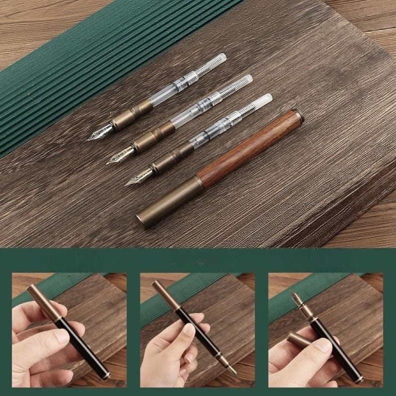 May include: A collection of fountain pens with brass and wood accents. The pens have clear ink reservoirs and ornate nibs. One pen is fully assembled, while others are disassembled. The pens are displayed on a wooden surface with a green textured background.