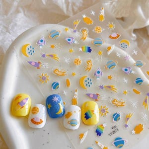 4pcs Space Cat Nail Stickers – Colorful Planet Rocket UFO Nail Decals for DIY Nail Art, Waterproof Astronaut Cat Galaxy Theme Nail Stickers