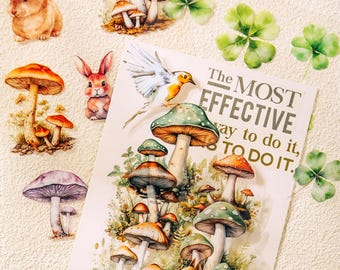 May include: A collection of nature-themed stickers featuring rabbits, various mushrooms, green clover leaves, and a bird. A central rectangular card displays a bird, mushrooms, a squirrel, and the text: The MOST EFFECTIVE way to do it, is TO DO IT.