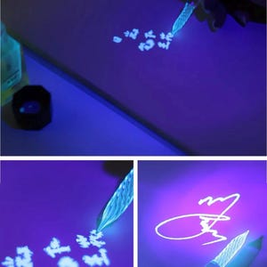 May include: A glass calligraphy pen with a detailed, textured design is shown writing on a purple surface. The pen is illuminated, creating a glowing effect. The image shows the pen writing characters and a signature.