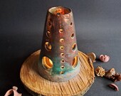 Beautiful ceramic candle holder raku on a piece of wood, tea light, candele, lemongrass, incens cone