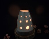 Beautiful ceramic candle holder raku on a piece of wood, tea light, candele, lemongrass, incens cone